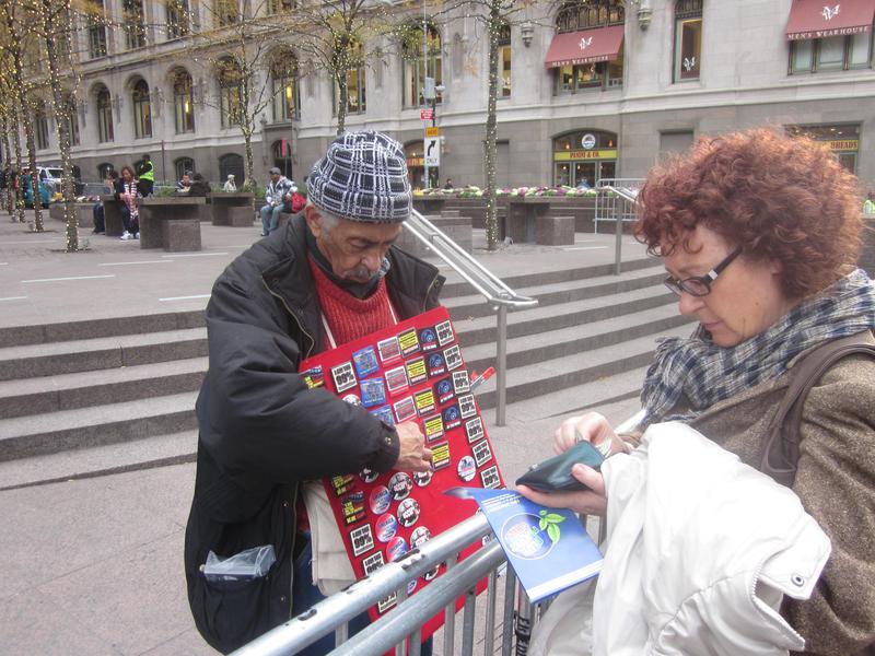 Selling OWS buttons for $2 apiece.